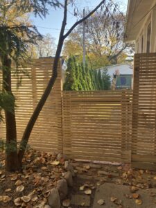 New fencing with cedar horizontal slots